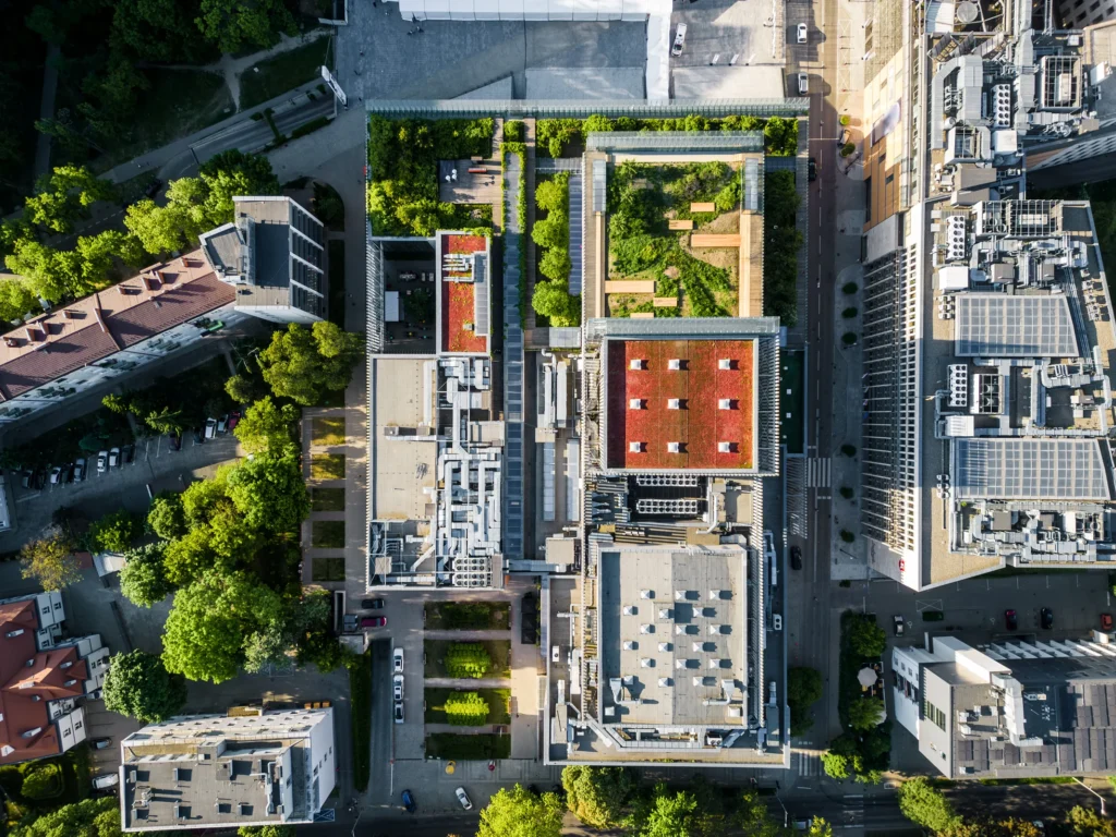 Aerial view of planted roofs and courtyards on a modern building.