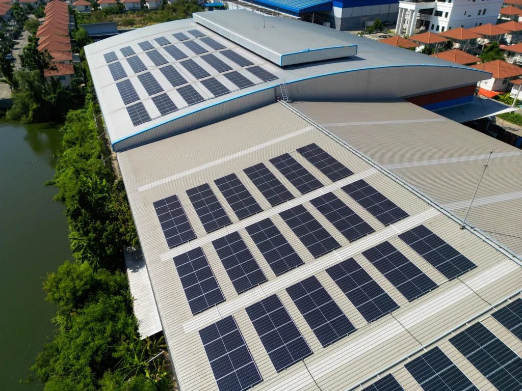 Solar panels across the roofs of industrial buildings.