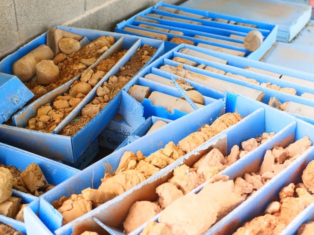 Soil and rock core samples arranged in divided sample boxes.